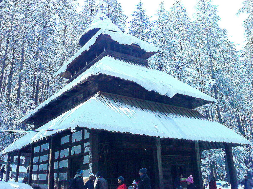 Hidimba Devi Temple with snow on its roof.