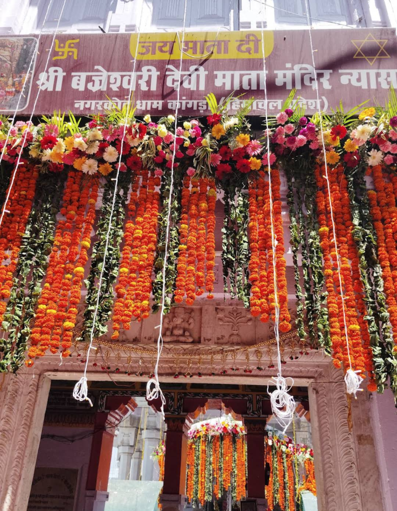 Entrance of Bajreshwari Devi Temple decorated with flower garlands.