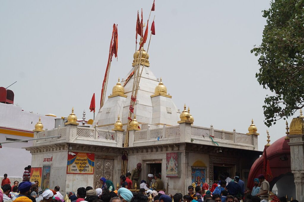 Naina Devi Temple in Himachal Pradesh with pilgrims gathered around